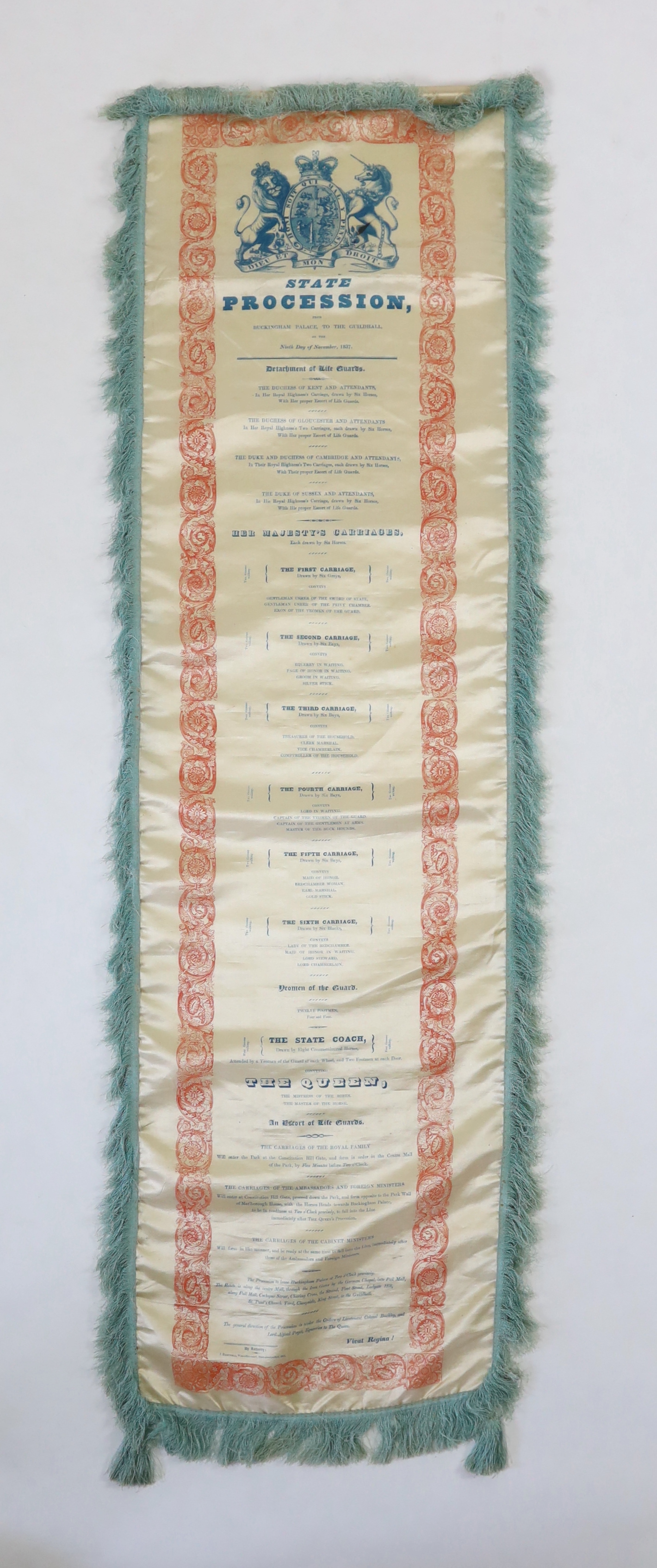 A silk banner; State Procession from Buckingham Palace to The Guildhall on the Ninth Day of November 1837. The day of Queen Victoria’s Coronation. Printed with the Royal Coat of Arms and a list of the guards, carriages a